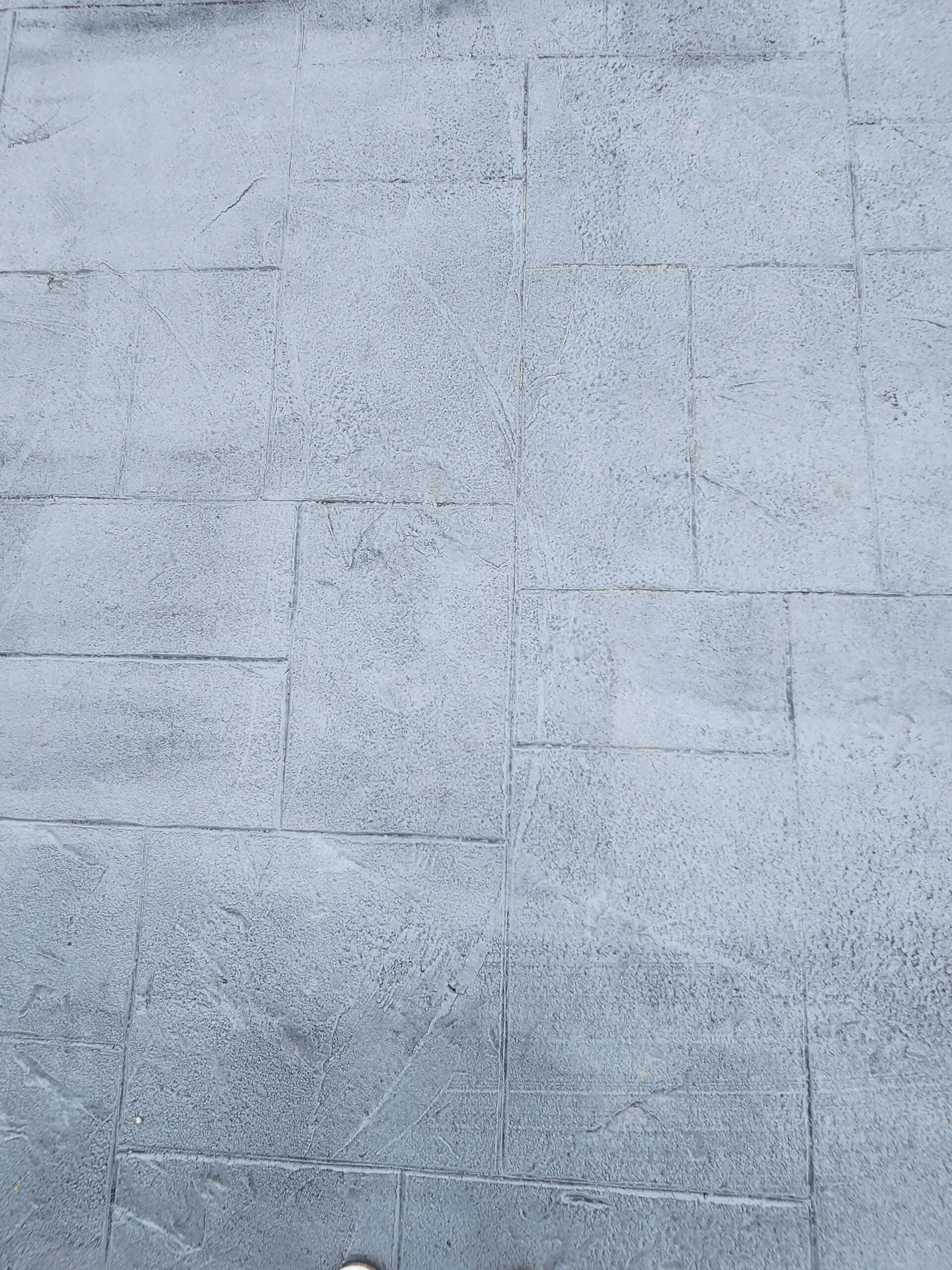 Stamped concrete surface showcasing textured design, relevant to outdoor projects by Capital Improvement, Metairie&rsquo;s trusted concrete contractor for patios and sunrooms.