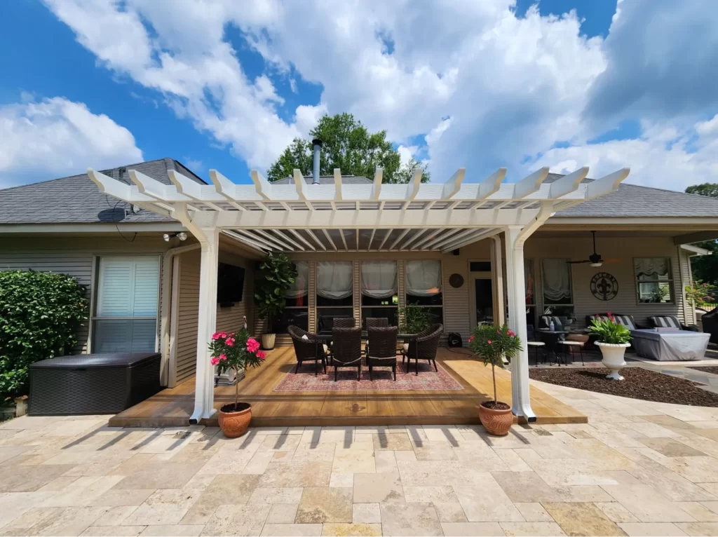 White pergola over patio creating an outdoor living space, enhancing home value in the United