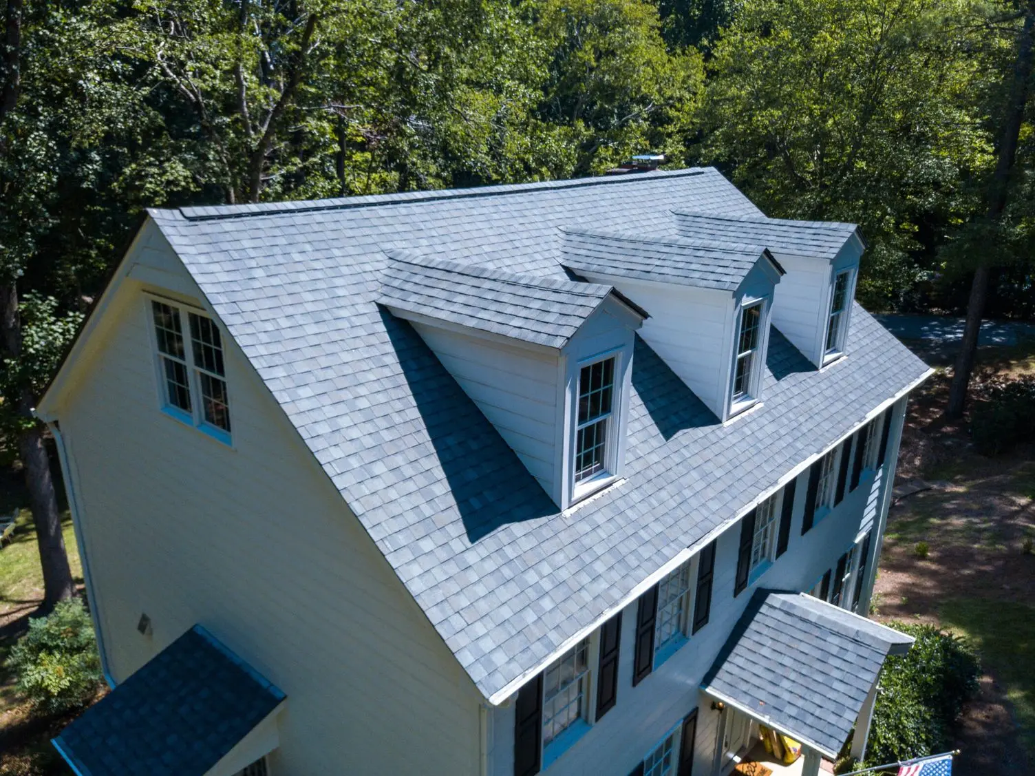 drone view of a home with architectural shingles