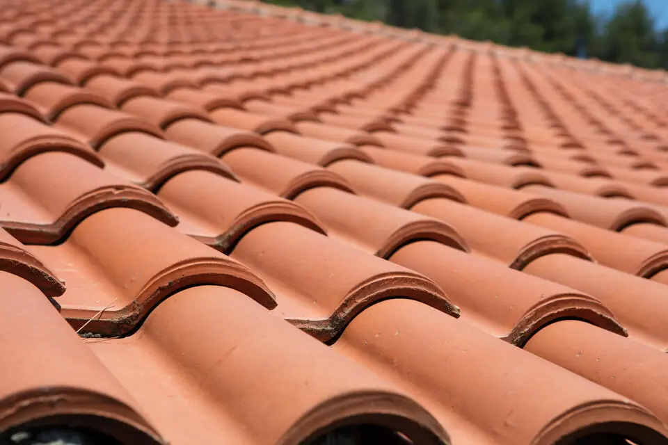 tile vs shingle roof-close up of terracotta tile roof