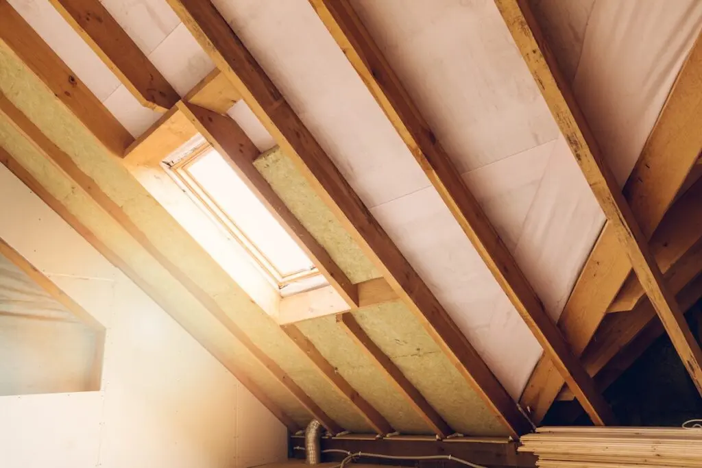 house attic under construction mansard wall insulation with rock wool attic rain