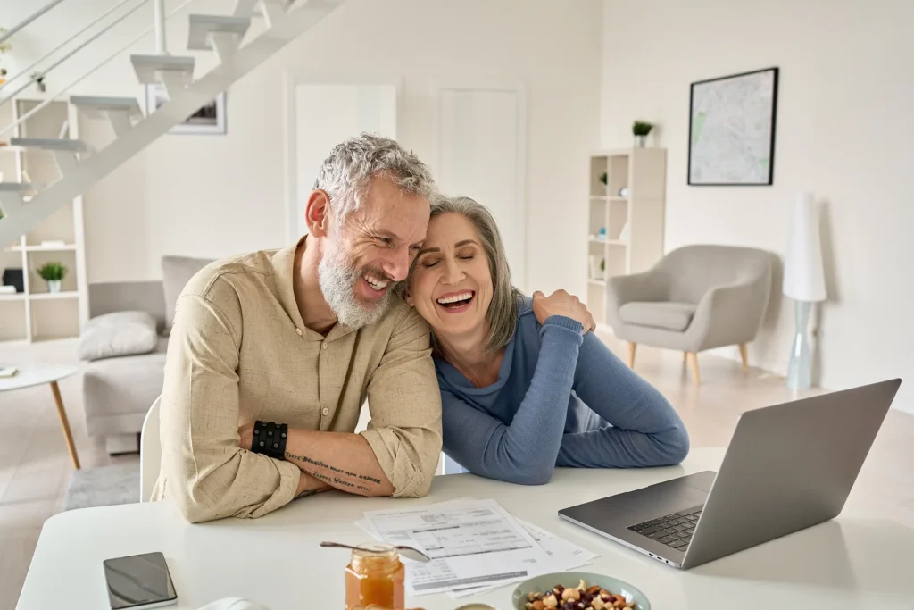 couple happy at home after new roof replacement