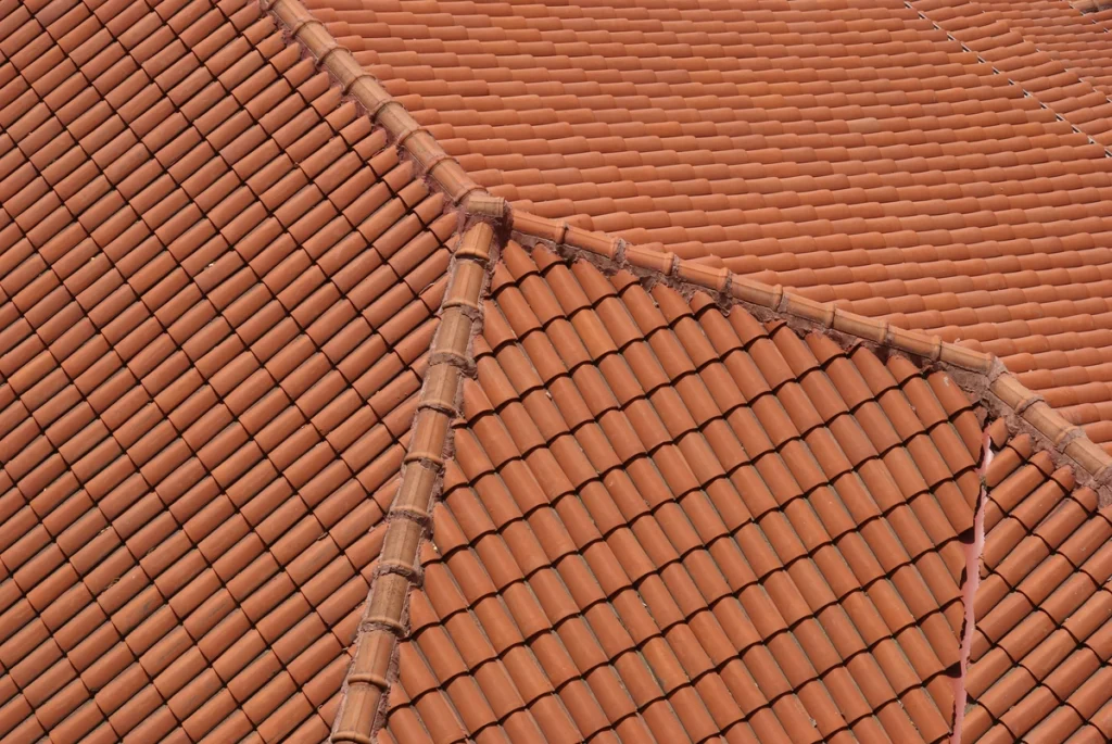 close up roof with red tiles on large house