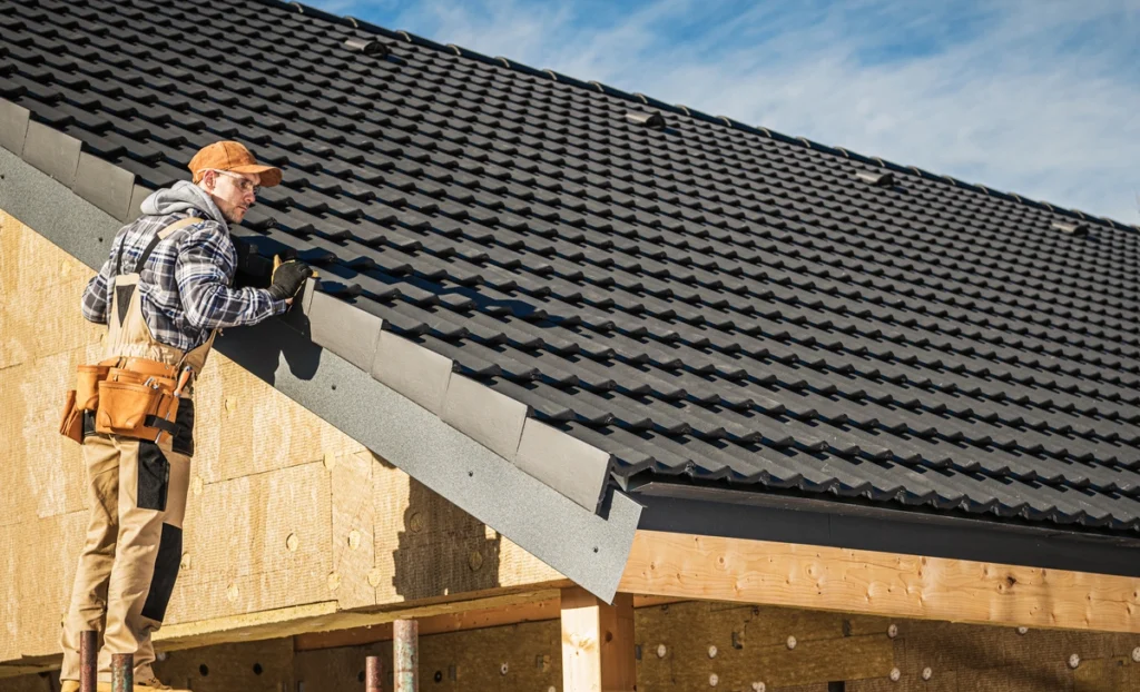 black metal tiles installed on new roof