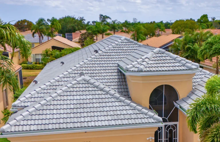 Distinctive Roofing - Malibu Royal Palm House with trees in the background