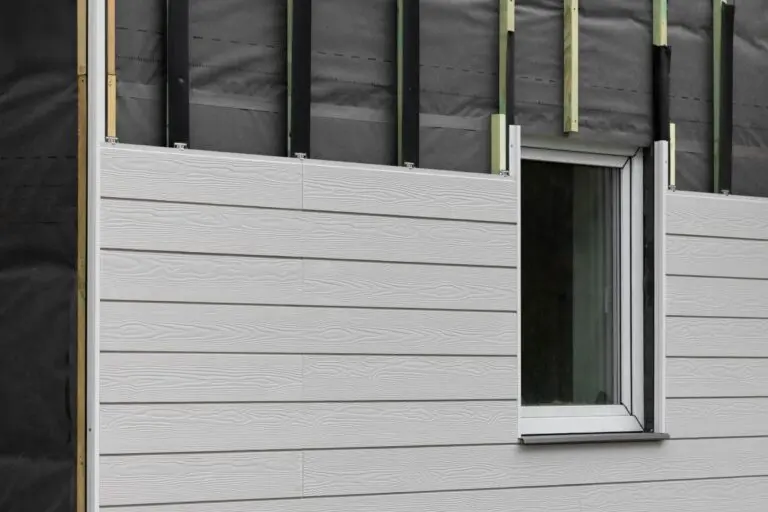 wood texture composite cladding installation on house facade