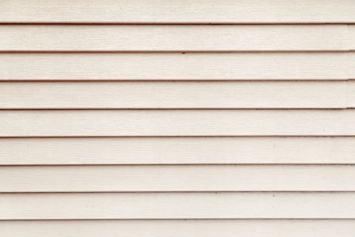 Slice the white siding on old house