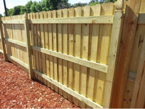Wood board on board privacy fence installation in Tampa