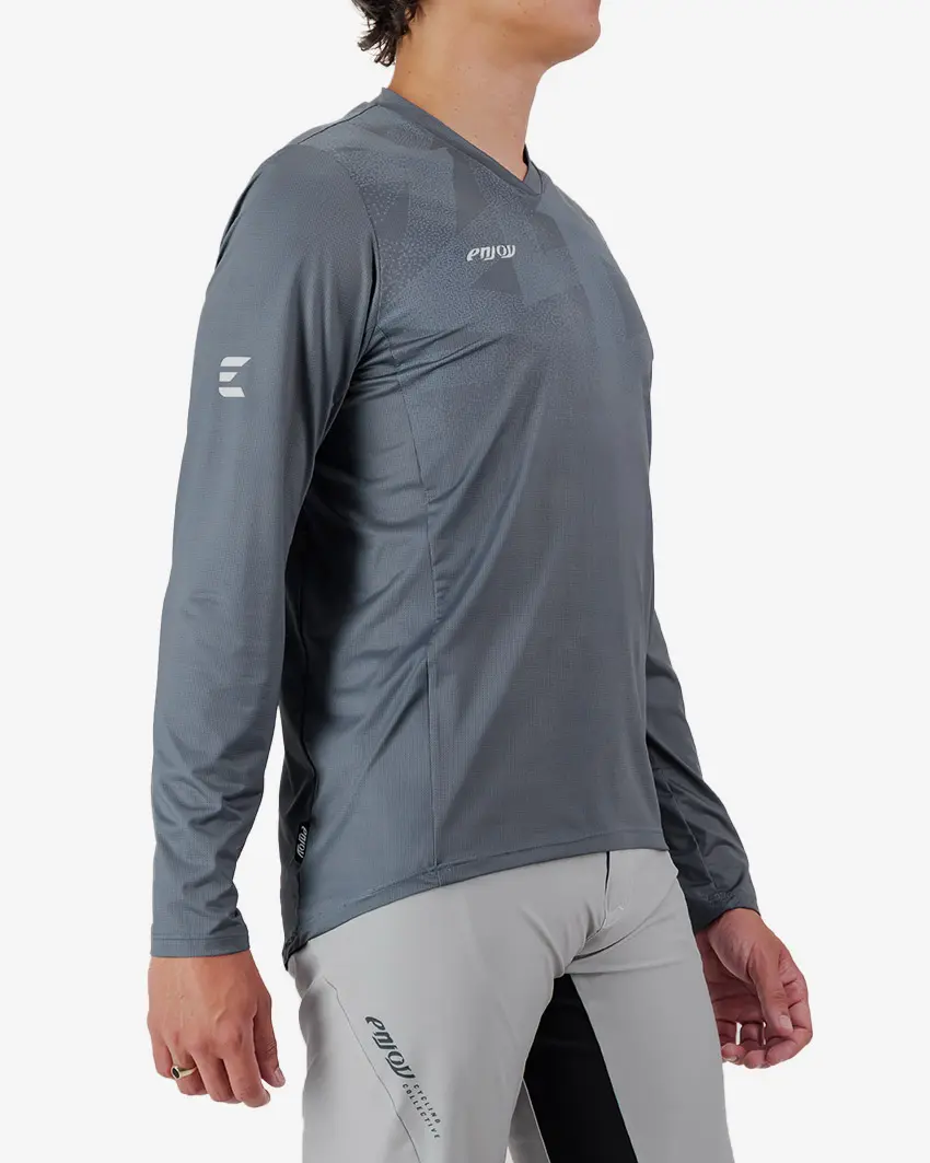 Side view of the Enjoy men's Enduro Long Sleeve Trail Tee in Dark Grey made by Enjoy.cc