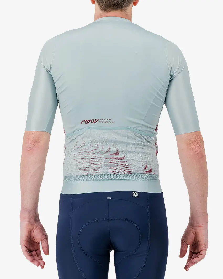 Back view of the Men's ProXision cycling jersey for in teal glitch colour way by enjoy.cc