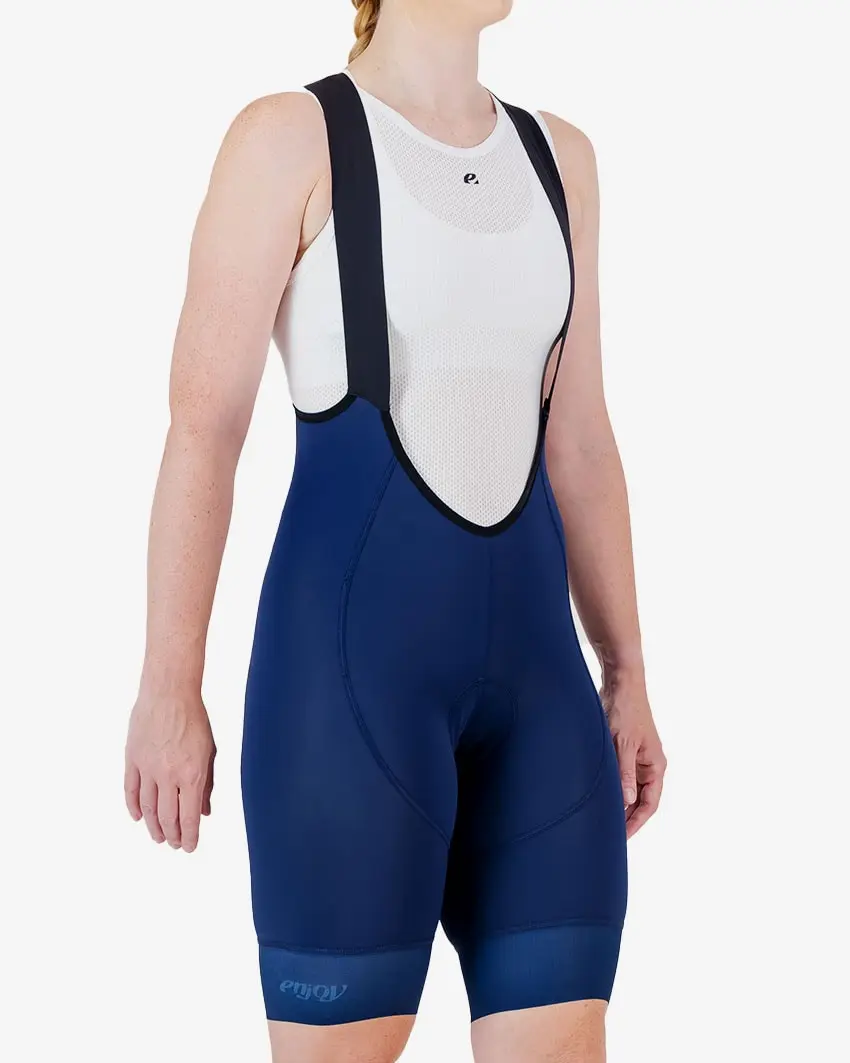 3qtr view of the Enjoy ProXision womens cargo bib short in the navy colourway made by enjoy.cc