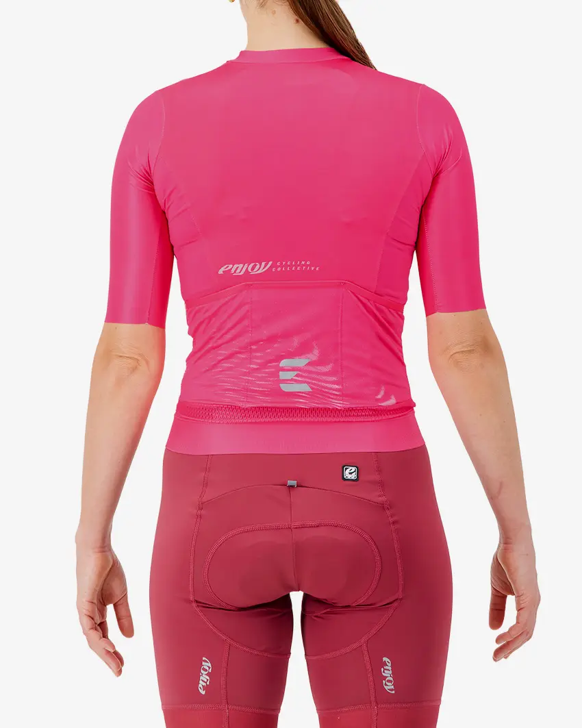 Back view of the Women's ProXision cycling jersey for in pink glitch colour way by enjoy.cc