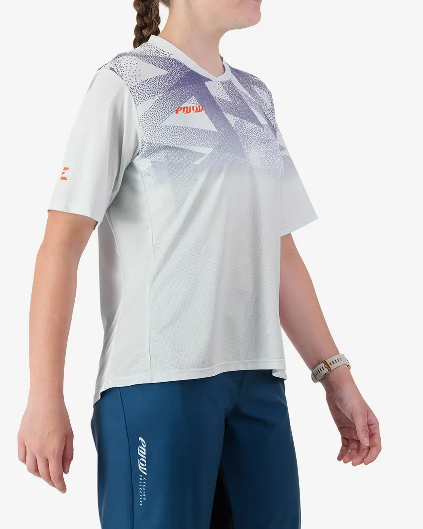 Side view of the Enjoy Women's Enduro Trail Tee in Beige with reflective detailing made by Enjoy.cc