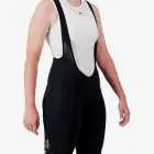 Side view of the Enjoy Octane women's bib short in black with reflective detail made by Enjoy.cc