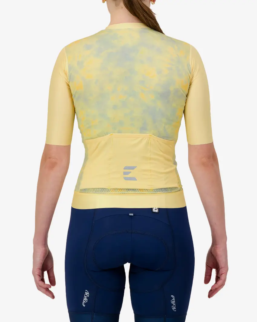Back view of the ProXision women's cycling jersey in a yellow tie-dye design made by enjoy.cc