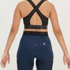 Back view of the womens sports bra in the black emotif design made by Enjoy.cc