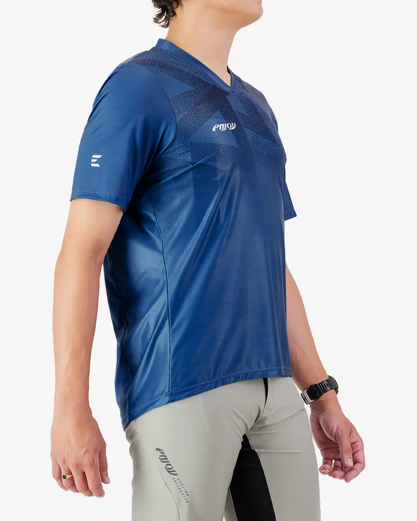 Side view of the Enjoy men's Enduro Trail Tee in Blue with reflective detailing made by Enjoy.cc