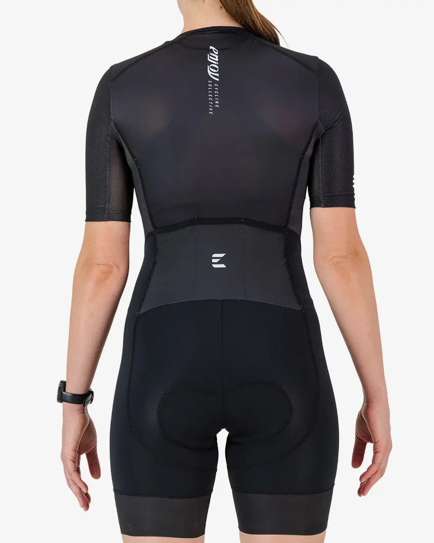 Back view of the women's sleeved triathlon suit in a minimal black design made by enjoy.cc