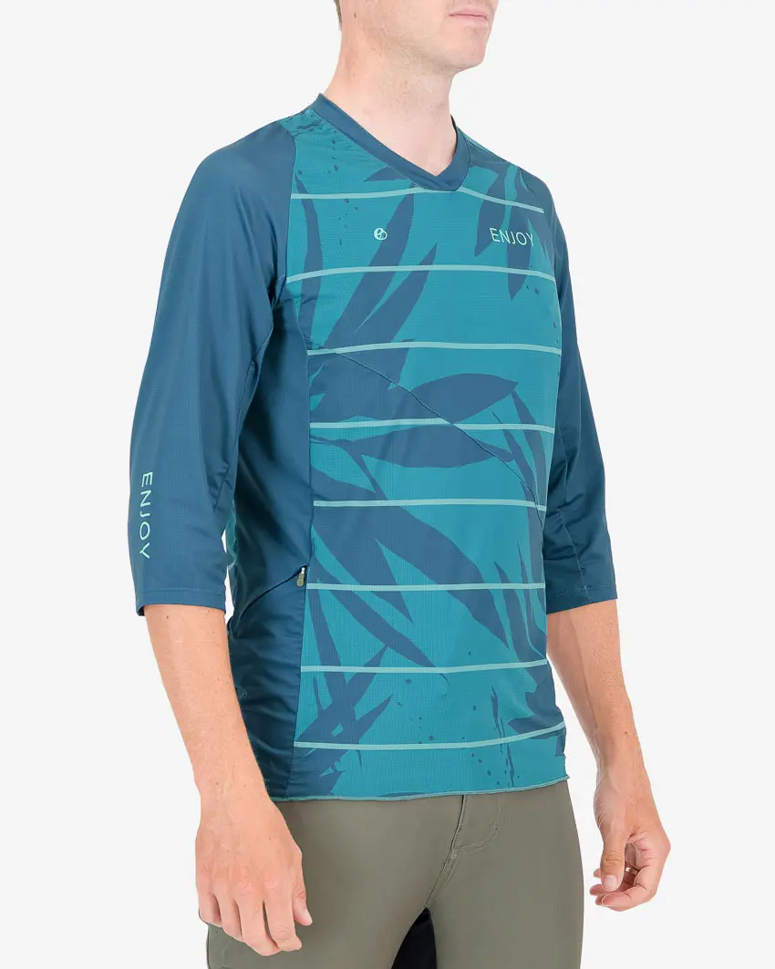 Three quarter view of the Enjoy mens enduro tee in the Flora design. Part of Reptilia trail range designed by enjoy.cc