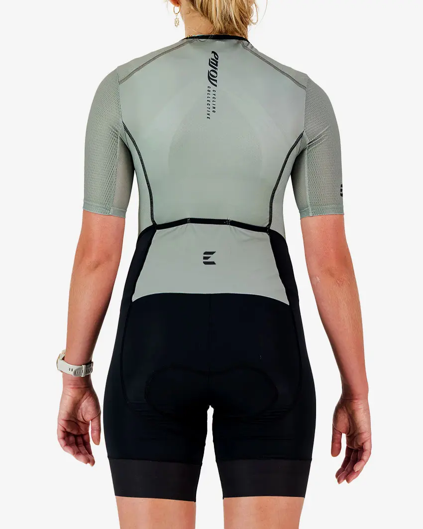 Back view of the women's sleeved triathlon suit in a green and black design made by enjoy.cc