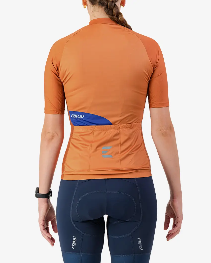 Back view of the Womens Supremium cycling jersey in a solid Clay colour way by Enjoy.cc