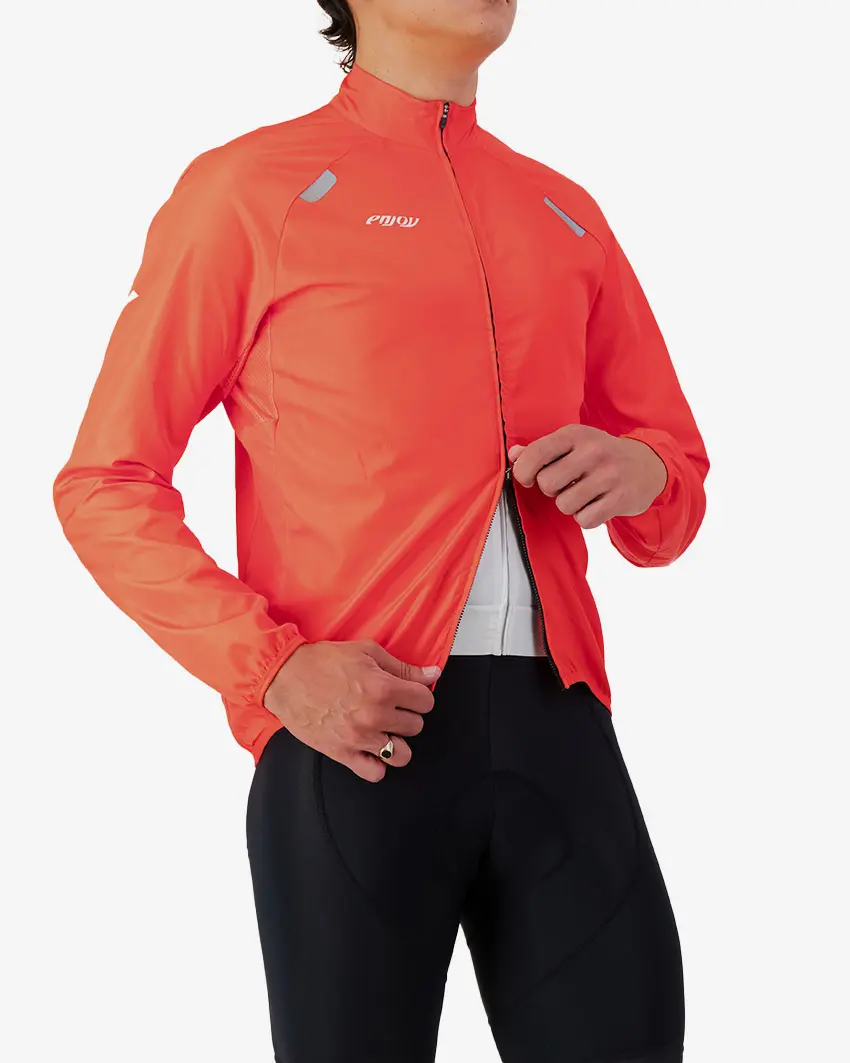 Side view of the Atom men's cycling jacket in a high-visibility Flame colour way by Enjoy.cc