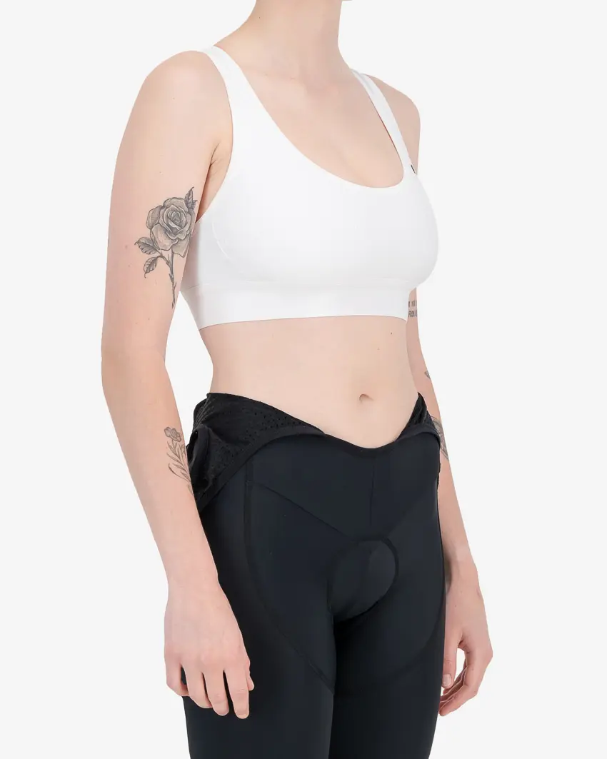 Side view of the Enjoy womens sports bra in the white colour way available at Enjoy.cc