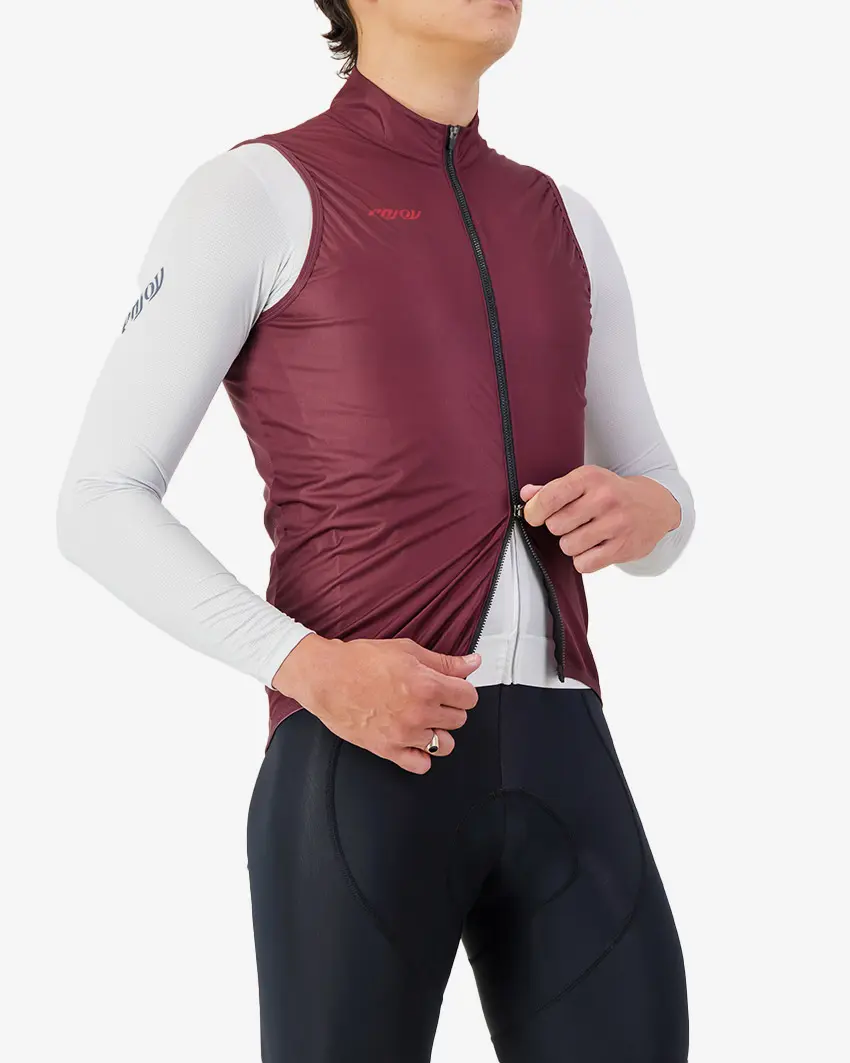 Side view of the scruncher Men's cycling gilet with open zip in a mahogany colour by Enjoy.cc
