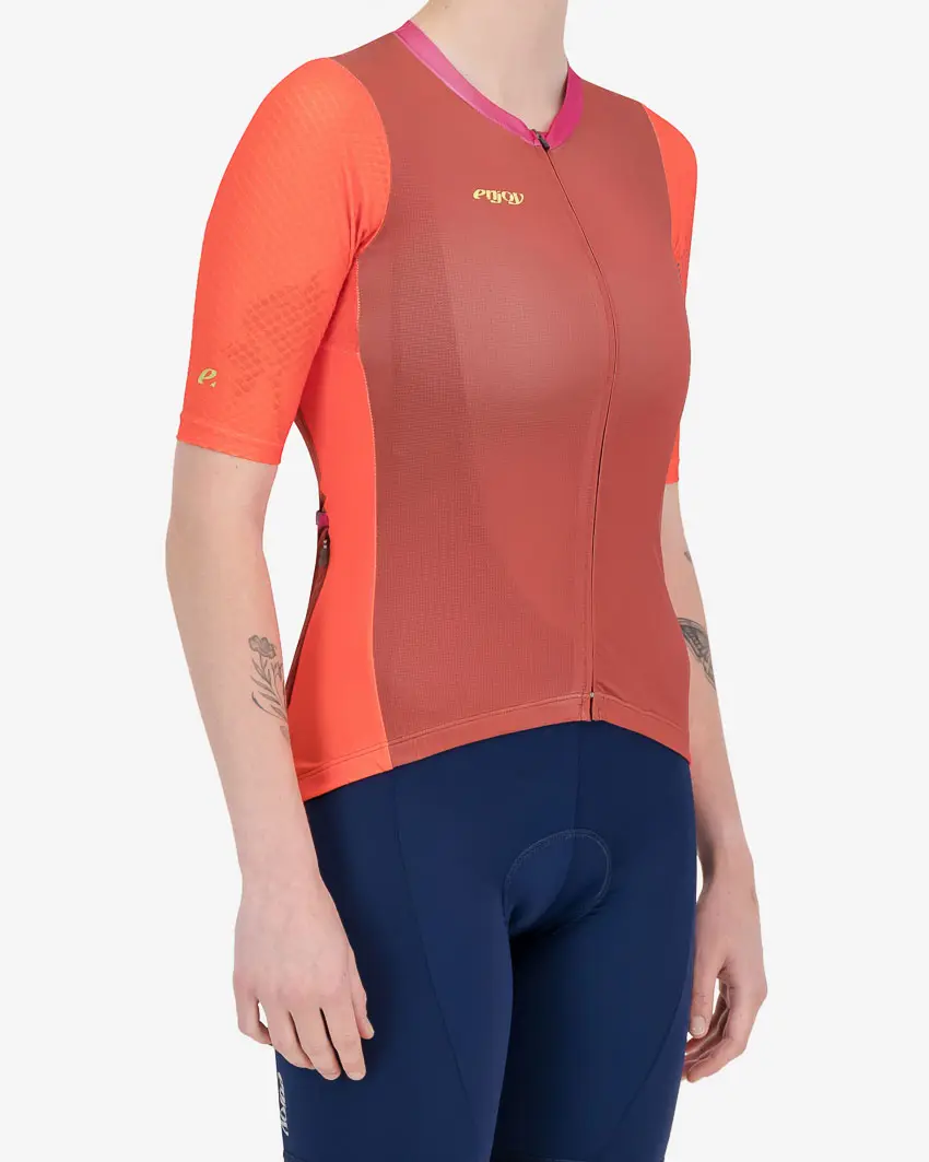 Side view of the Enjoy ProXision womens cycling jersey in the Ascendant orange design from Enjoy.cc