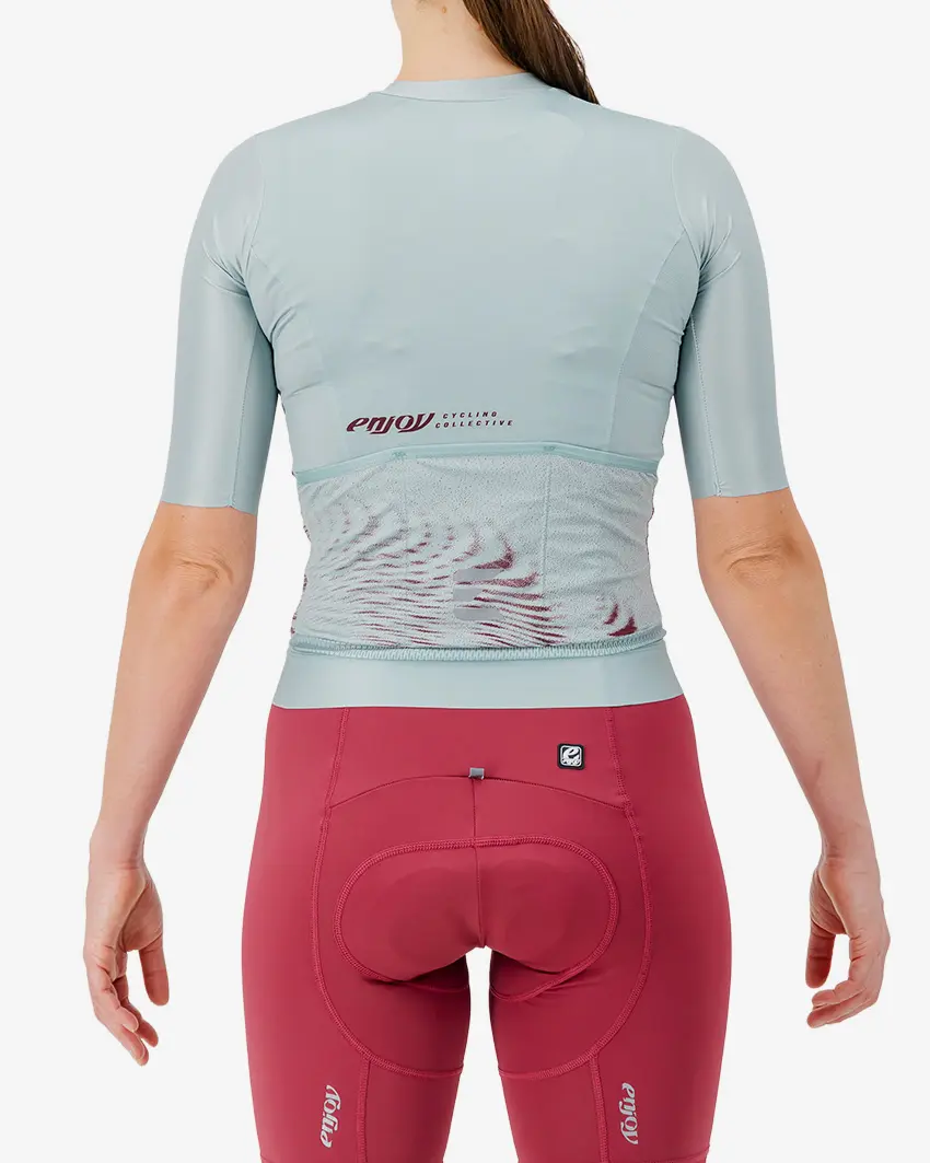 Back view of the Women's ProXision cycling jersey for in teal glitch colour way by enjoy.cc