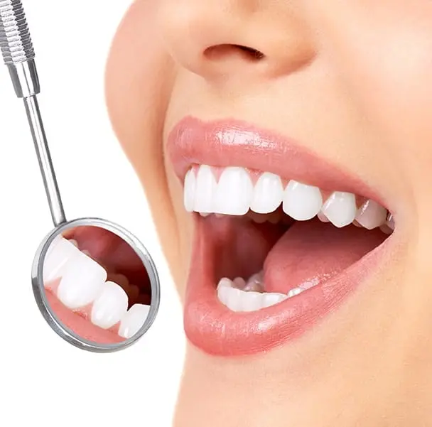 Photo of a woman with beautiful teeth after dental restorations in Greenwood Village, CO