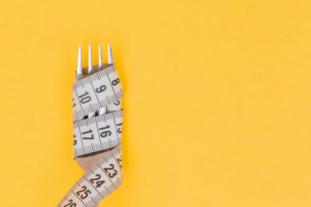 measuring tape wrapped around fork