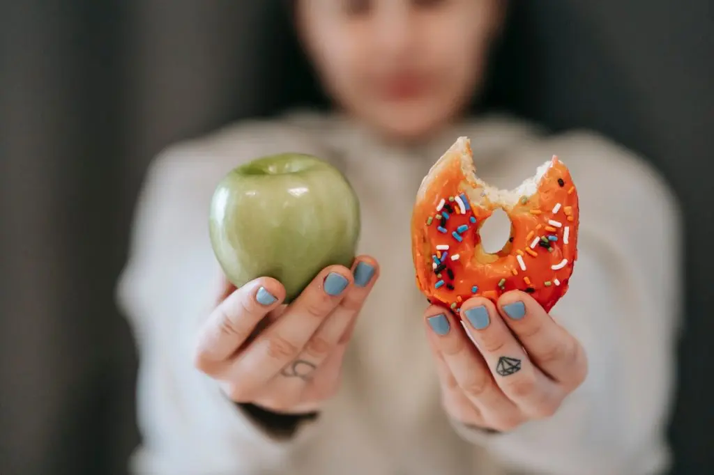 close-up of apple and donut
