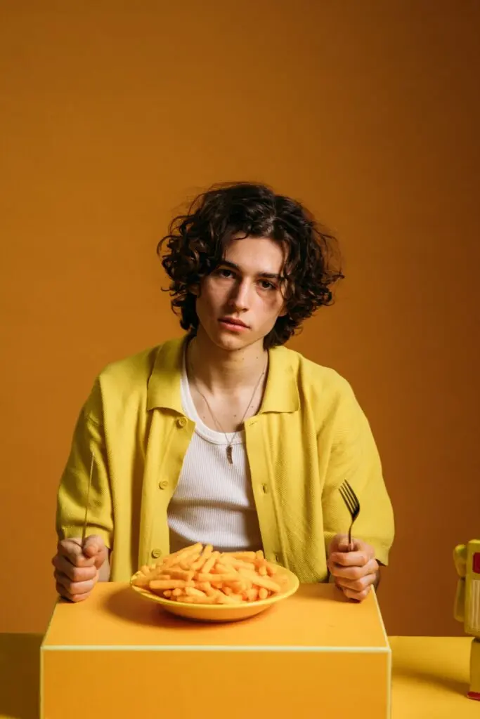 man with food in front of him