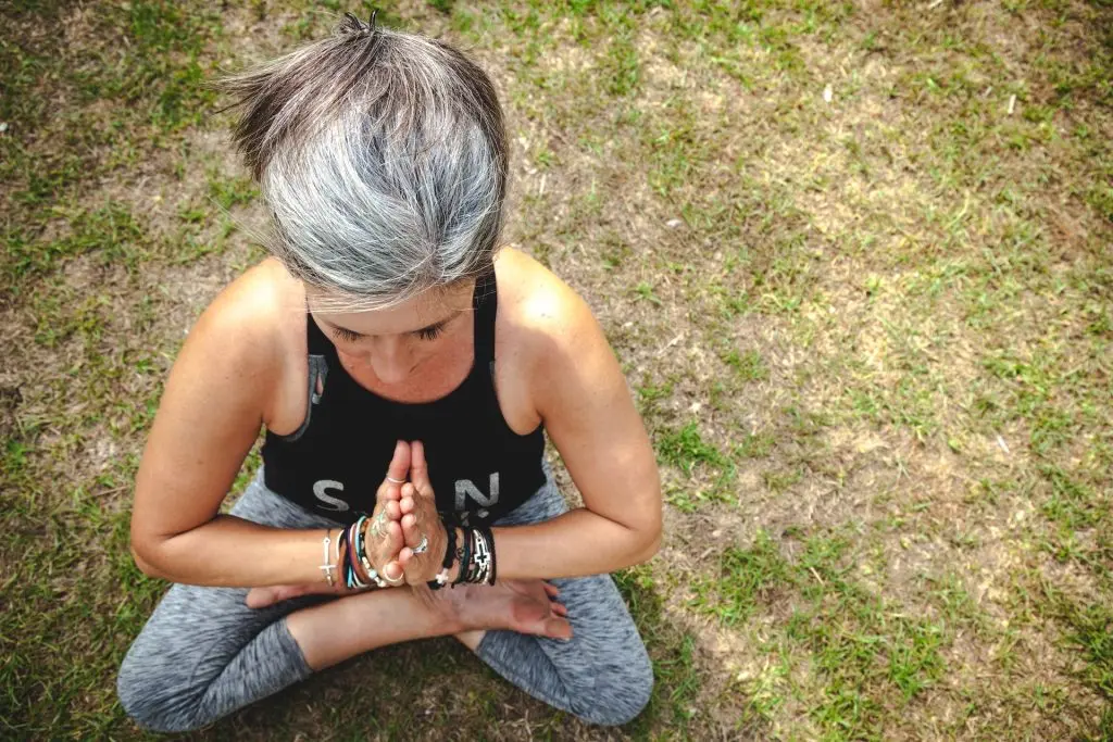 older woman practicing yoga, Menopause