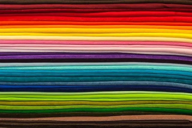 How To Find The Scrubs You Love: Expert Tips For Every Body Type 3 Scrubs fabrics come in all colors and fabrications and this shows a range of colors.