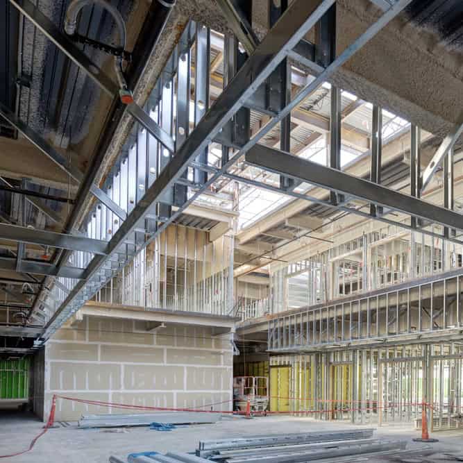 Steel,Studs,Used,To,Frame,In,A,Large,Commercial,Building. Steel studs inside a commercial building under construction