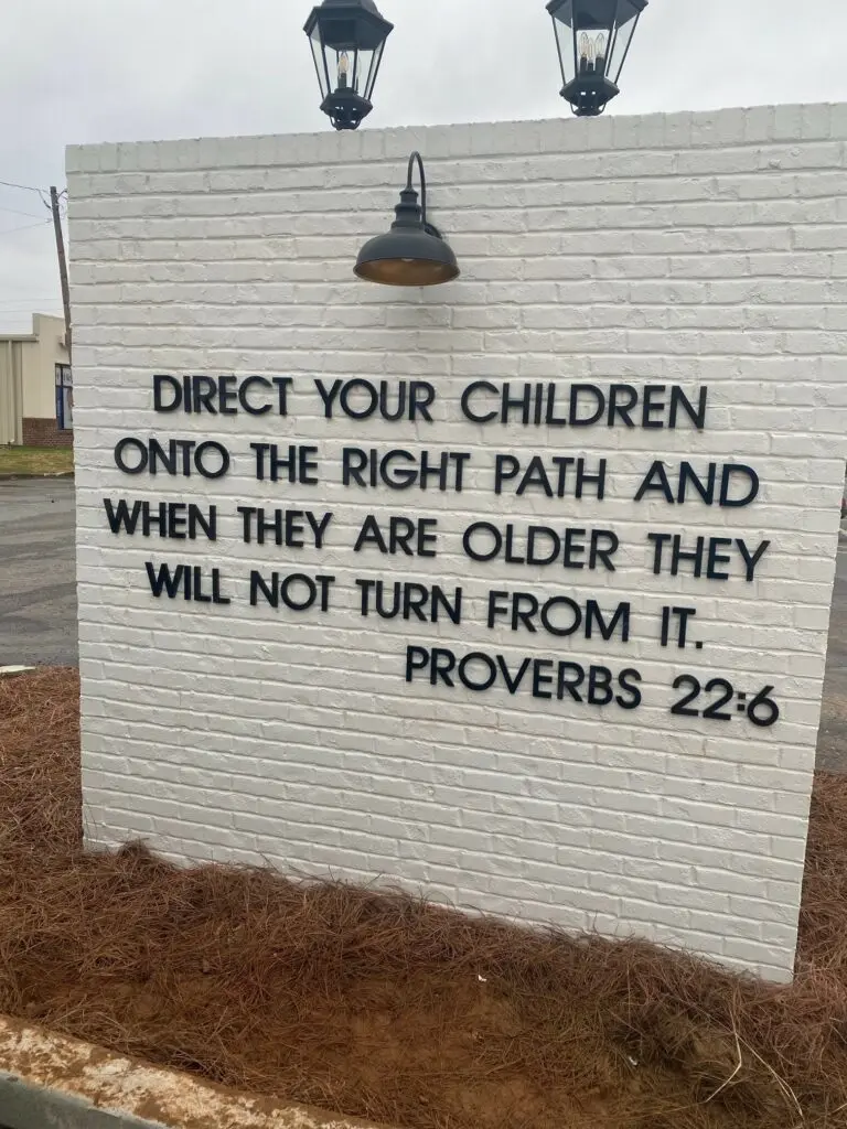 brick wall sign with letters