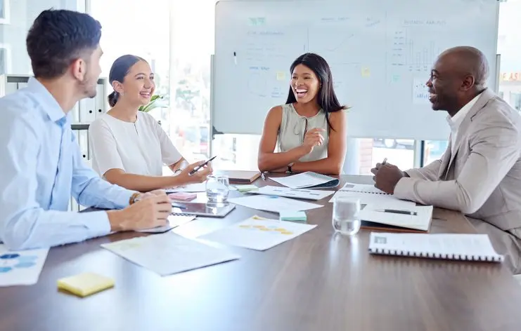 Happy business people, teamwork or corporate financial meeting review, leader consulting or collaboration. Goals, success or workshop with group in conference for planning, training or KPI growth
