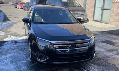 Auto detailer polishing dashboard and console in Kearny New Jersey