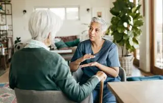 Caregiver-providing-personalized-support-to-an-older-adult-in-a-residential-assisted-living-home.jpg