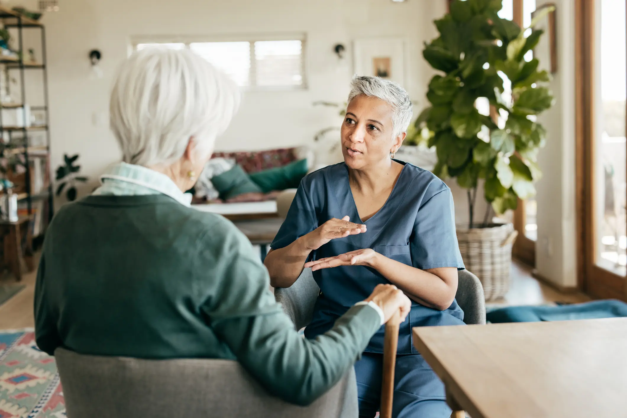 Caregiver-providing-personalized-support-to-an-older-adult-in-a-residential-assisted-living-home.jpg