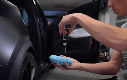 Professional ceramic coating application on automotive paint