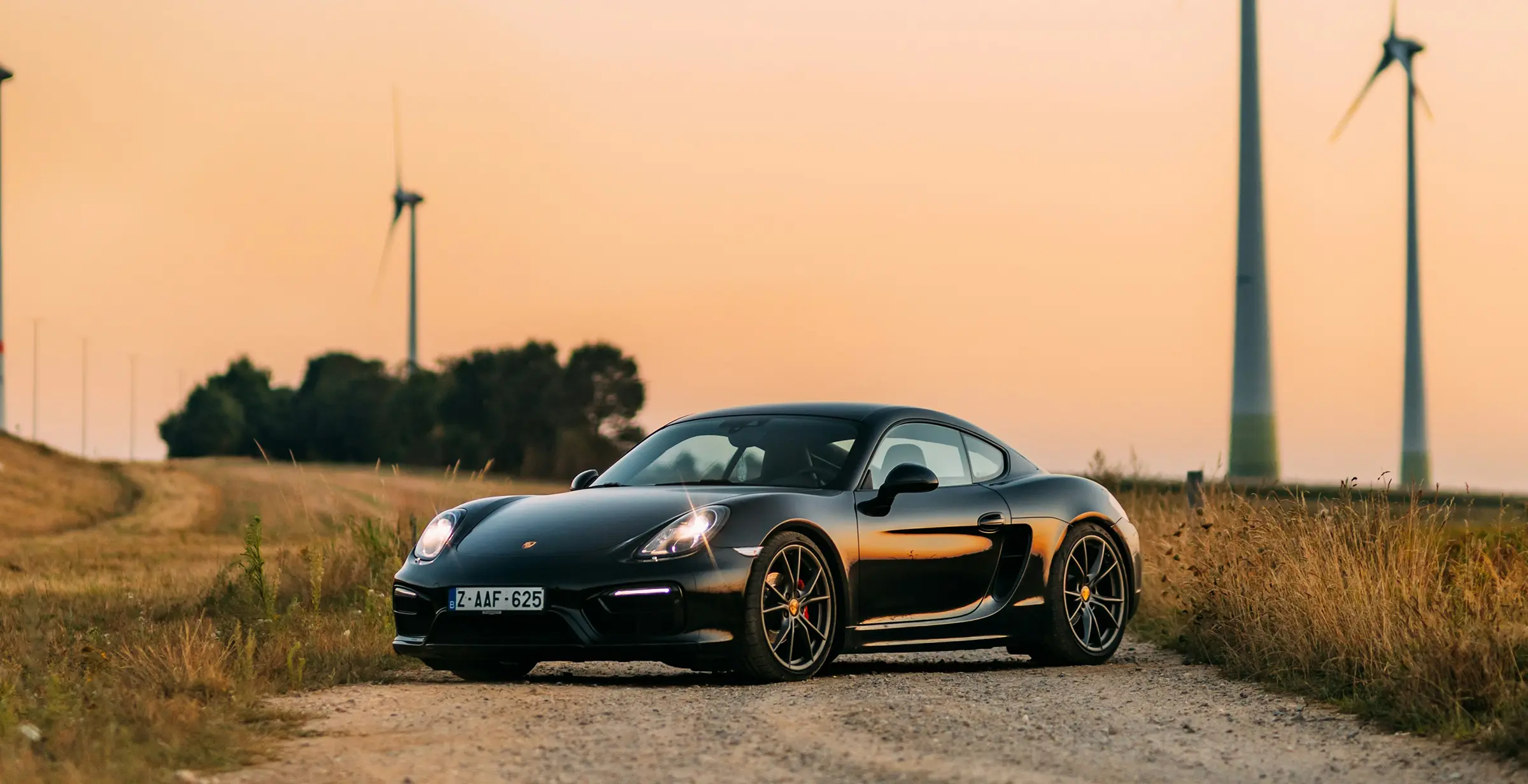 Glossy black sports car protected with ceramic coating