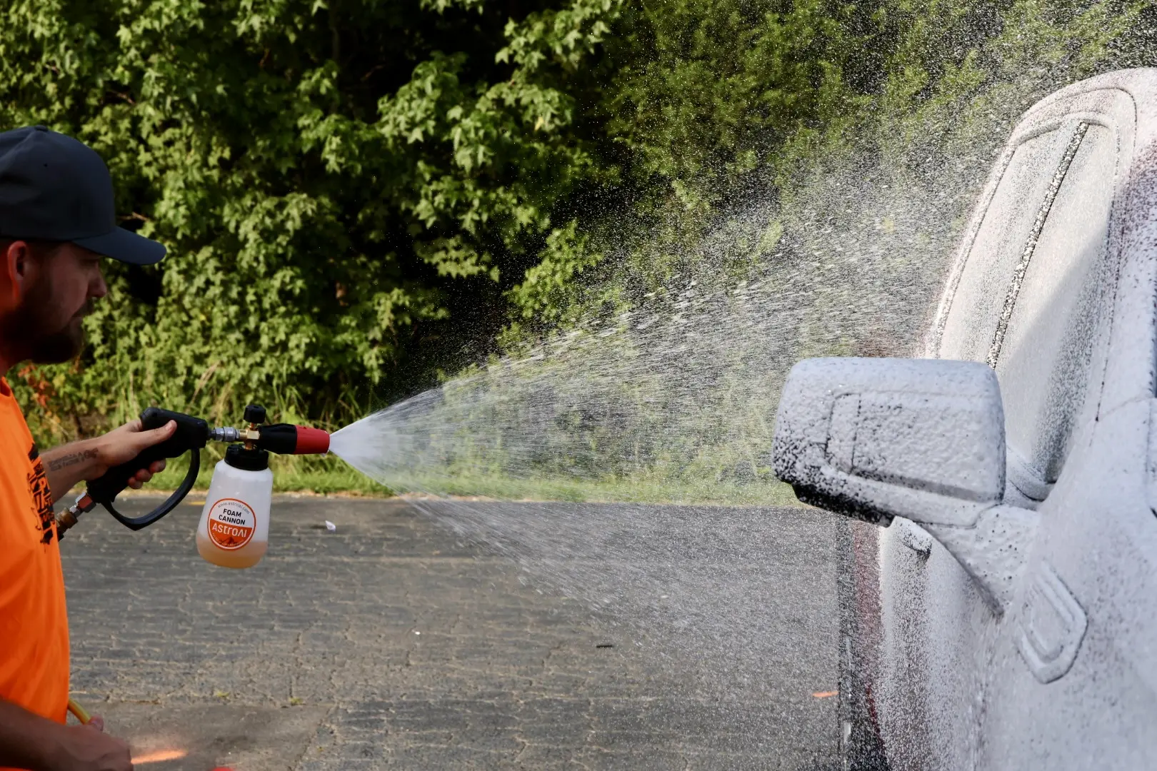 Professional car detailing with thick suds and foam