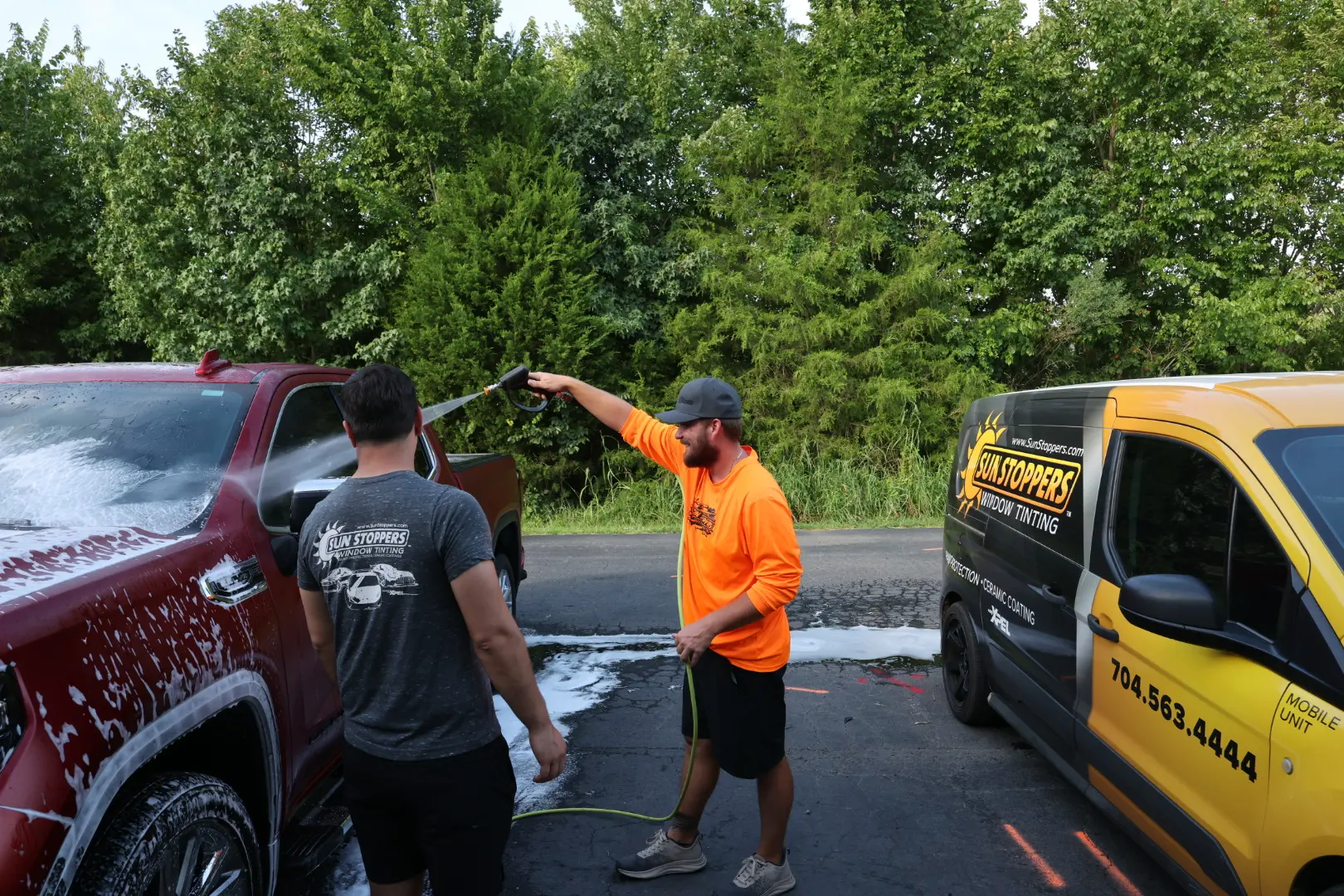 Car being professionally washed before paint protection