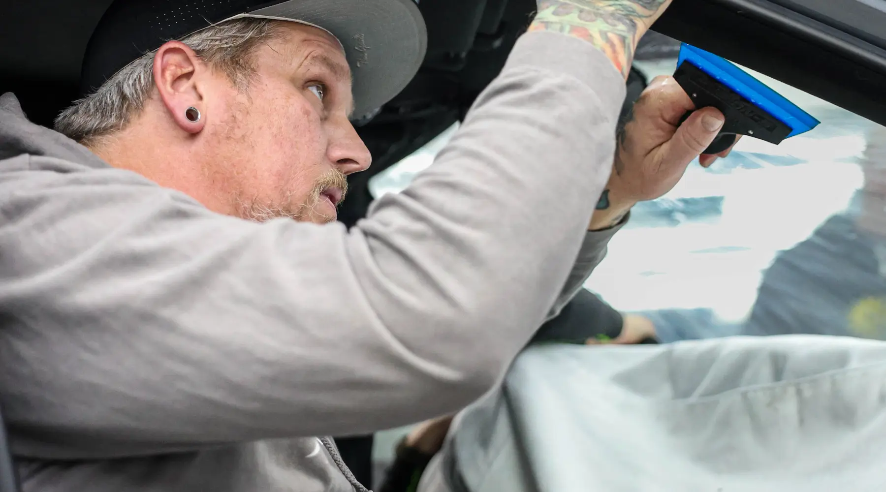 Professional automotive window tint installation detail