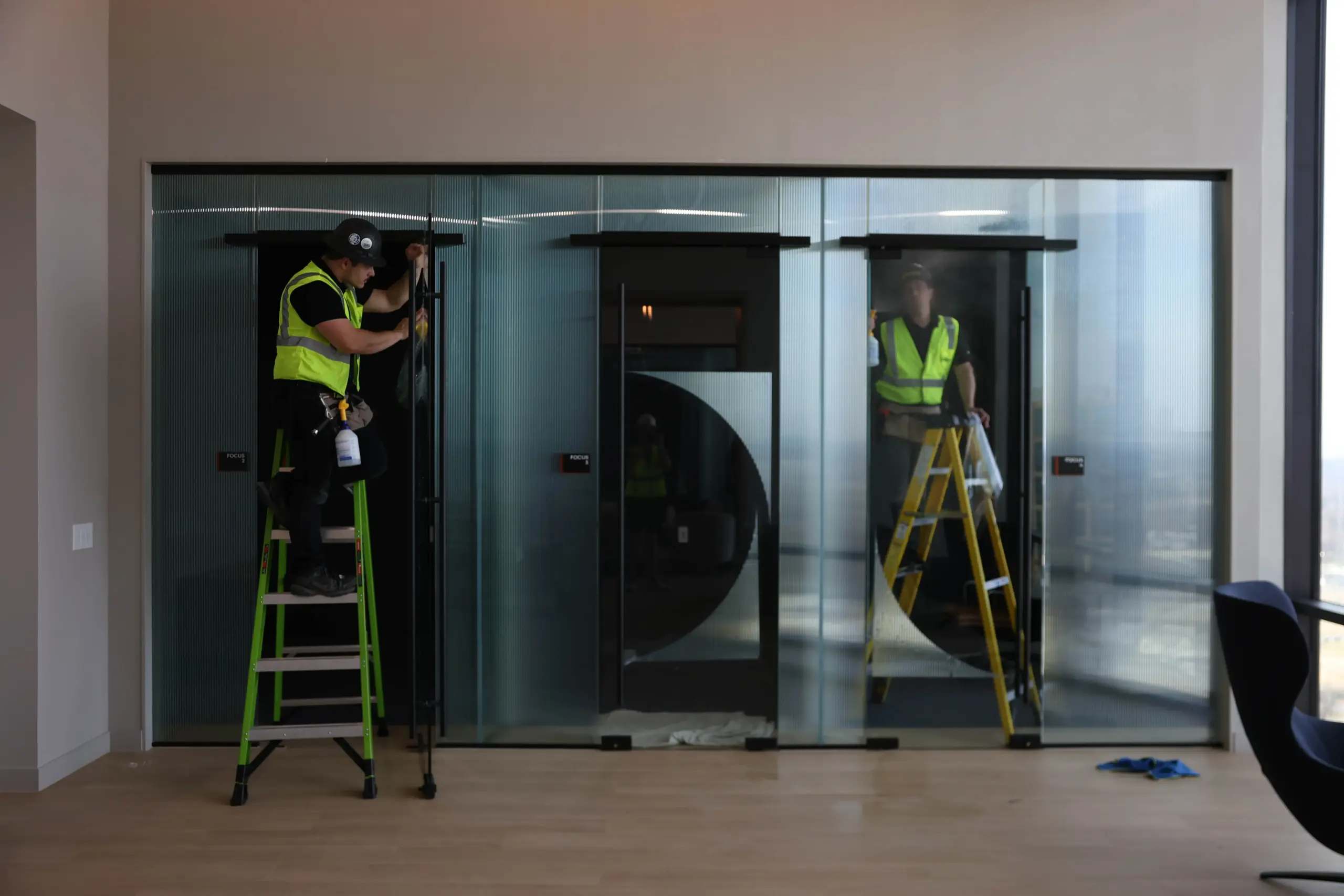 Commercial window film installation on office glass