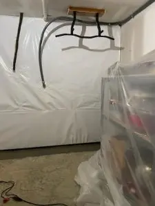 Basement water damage repair completed with professional waterproofing vapor barrier installation to prevent moisture intrusion and improve foundation protection.