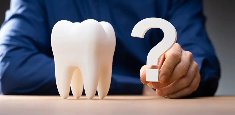 Huge tooth with a question mark next to it